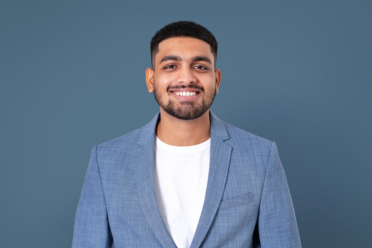 Cheerful indian businessman smiling closeup portrait jobs career campaign