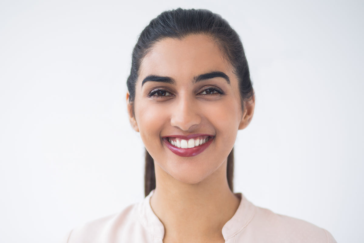 Closeup smiling young beautiful indian woman